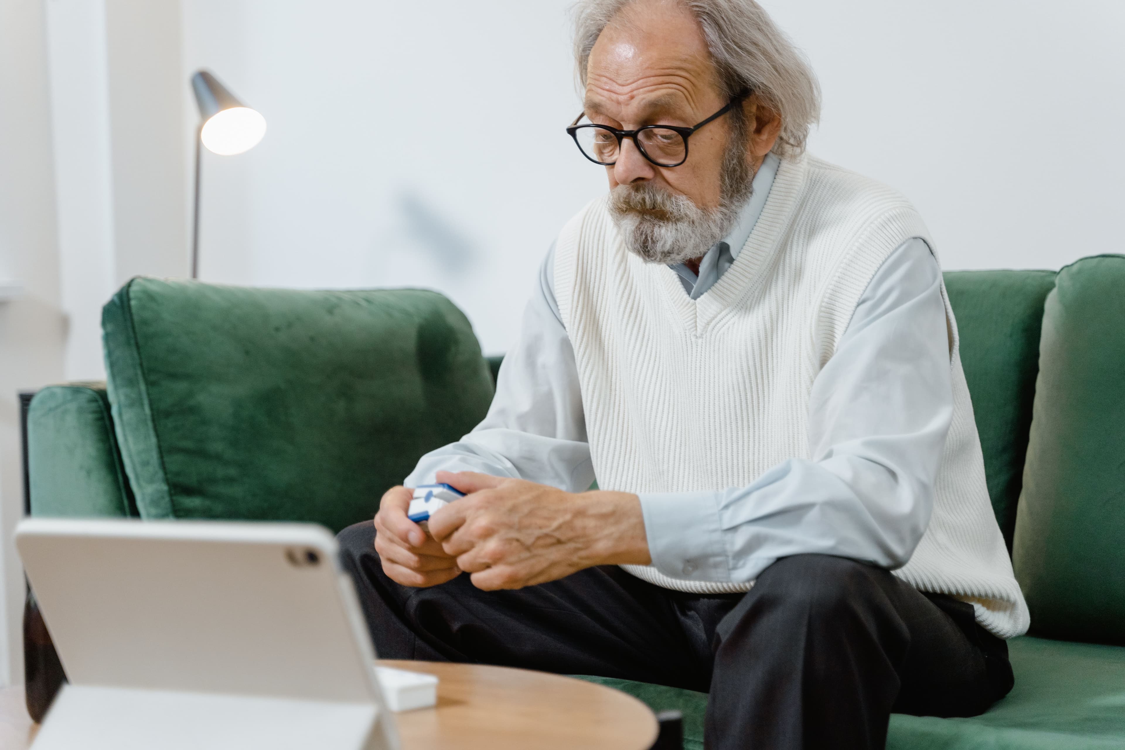 Patient using a remote monitoring device at home